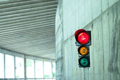 Road signal by wall