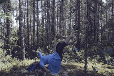 Midsection of person in the forest