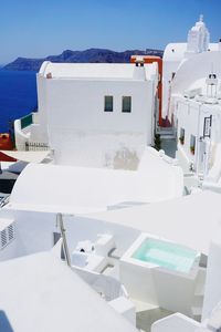 White building against sky in oia