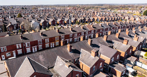 High angle view of terraced houses rooftops buildings in uk northern city