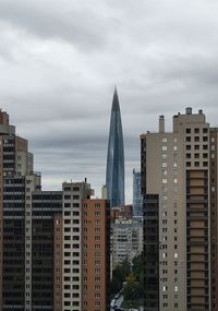 Modern buildings in city against sky