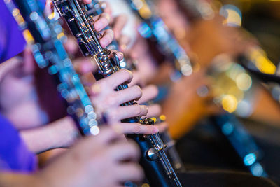 Close-up of hands playing guitar