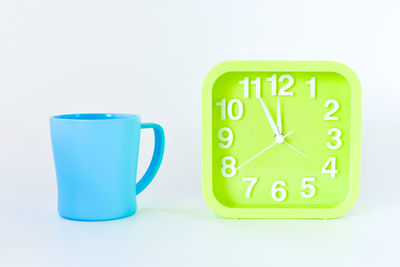 Close-up of clock against white background