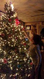 Full frame shot of illuminated christmas tree at home
