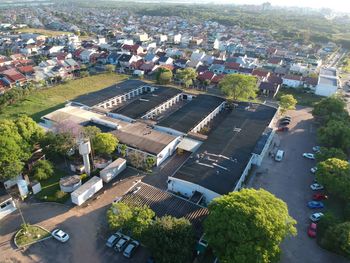 High angle view of vehicles on road amidst buildings in city