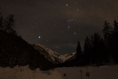 Scenic view of landscape against sky at night