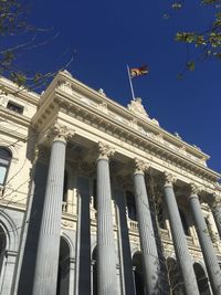 Low angle view of historical building against blue sky