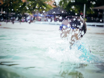 Boy swimming in pool