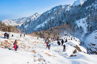 People on snowcapped mountains