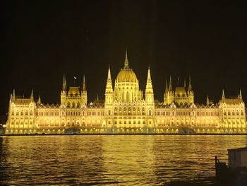Illuminated buildings at waterfront