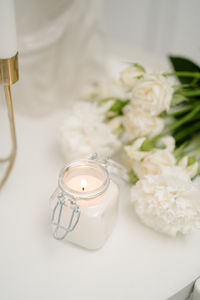 High angle view of white roses on table