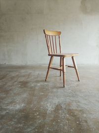 Wooden chair in empty room