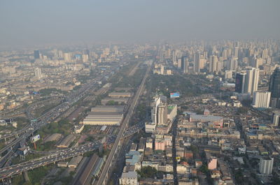 High angle view of buildings in city against sky