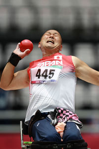 Midsection of man wearing mask