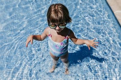 High angle view of cute boy in swimming pool