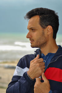 Portrait of young man looking away