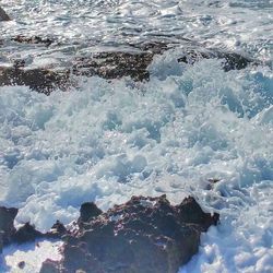 Waves splashing on rocks