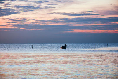 Scenic view of sea at sunset