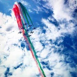 Low angle view of airshow against sky