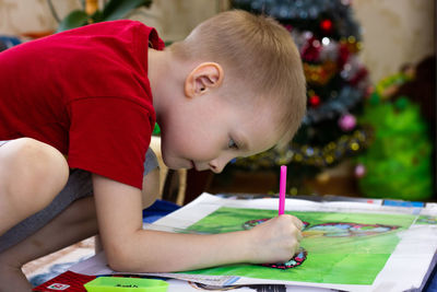 Boy painting at home