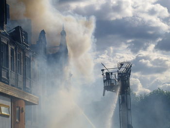 Water being sprayed on building during fire