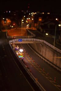 High angle view of light trails on road at night