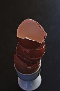 Close-up of ice cream cone against black background