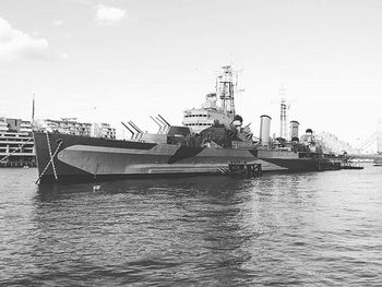 Boats moored at harbor