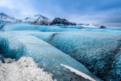 Scenic view of sea against sky during winter