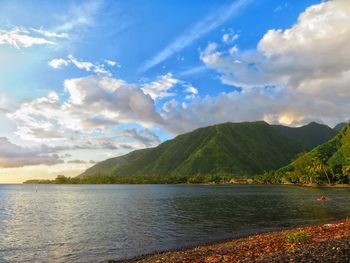 Scenic view of lake and mountains against sky