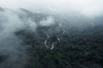 High angle view of fog on land against sky