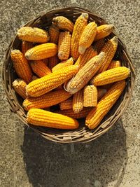 High angle view of yellow corn  in container