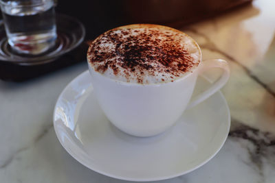 Close-up of cappuccino on table