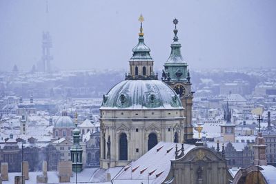 Buildings in city against sky