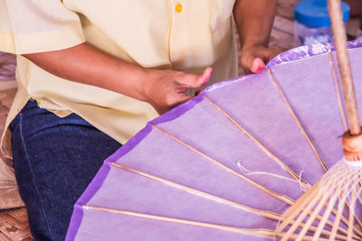 High angle view of people holding purple