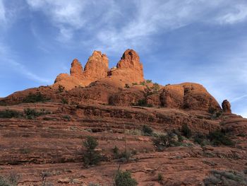 Low angle view of rock formations against sky. beautiful red rocks enhanced by the sunlight. 