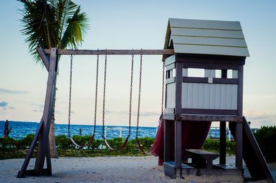 Built structure on beach against sky