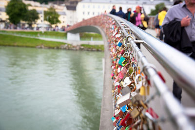 Padlocks on bridge over river