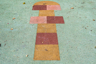 High angle view of multi colored umbrella on road