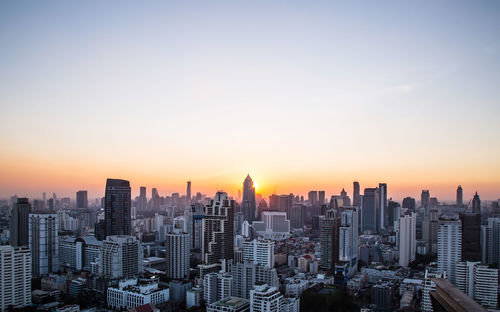 Cityscape against sky during sunset