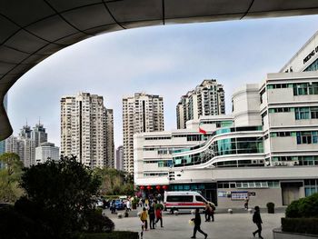 Buildings in city against sky