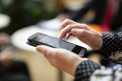 Close-up of woman using mobile phone