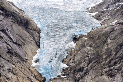 Scenic view of snow covered rocks