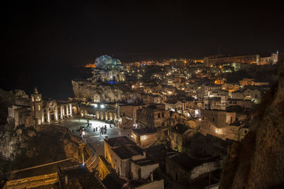 High angle view of illuminated buildings in town at night