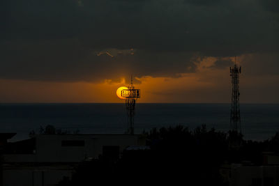 Sunset over the ocean in the village of albion, mauritius.