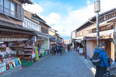 People walking on street market in city