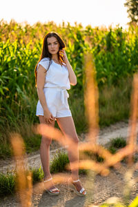 Young woman standing on field