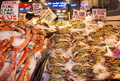 Dungeness crabs on ice at pike's pier. seattle, wa, usa