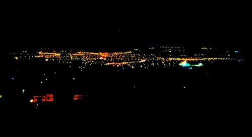 Illuminated cityscape at night