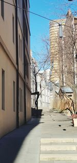 Street amidst buildings against sky